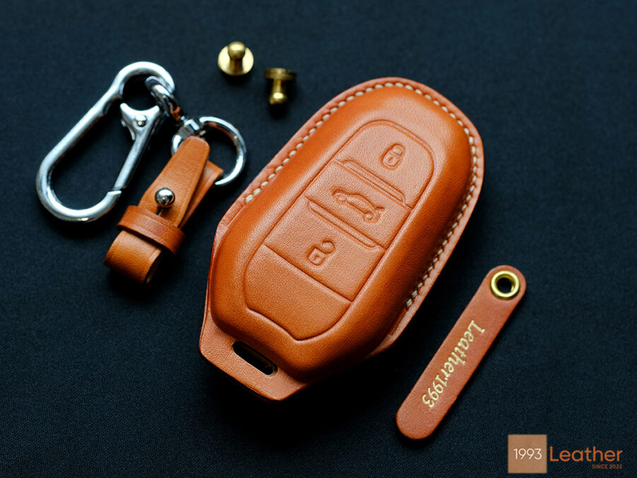 Peugeot 208 key fob cover made of premium leather, delivering a luxurious design and durable protection for your key.