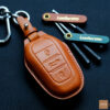 Peugeot 208 key fob cover made of premium Veg-Tanned leather, representing durability and elegance for key protection.