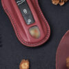 Close-up of Porsche Cayenne key fob cover showing fine, elegant stitching and how fit cover is