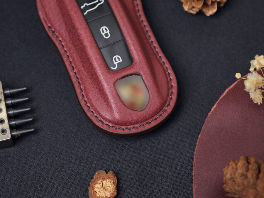 Close-up of Porsche Cayenne key fob cover showing fine, elegant stitching and how fit cover is
