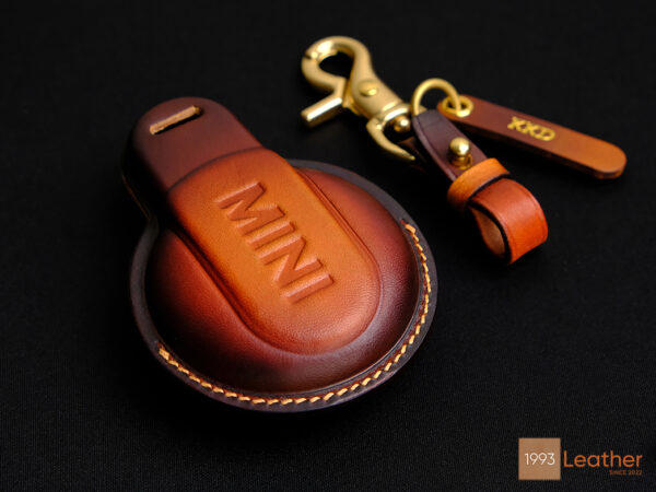 Handcrafted Mini 3-Door Hatch key fob cover with embossed MINI logo on the back and premium stitching detail.