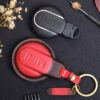 Back of Mini Countryman key fob cover in premium leather with embossed MINI logo and vibrant stitching