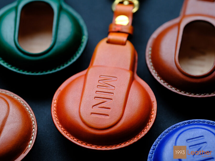 Back of Mini Countryman key fob cover in premium leather with embossed MINI logo and vibrant stitching