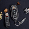 The vegetable-tanned leather Porsche 718 key fob case features natural textures, precision stitching, and personalized key tags for a luxurious, eco-friendly design.
