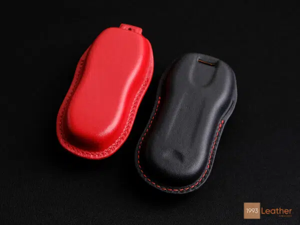 Close-up of Porsche Panamera key fob cover, featuring meticulous stitching and craftsmanship, with a view of the back.