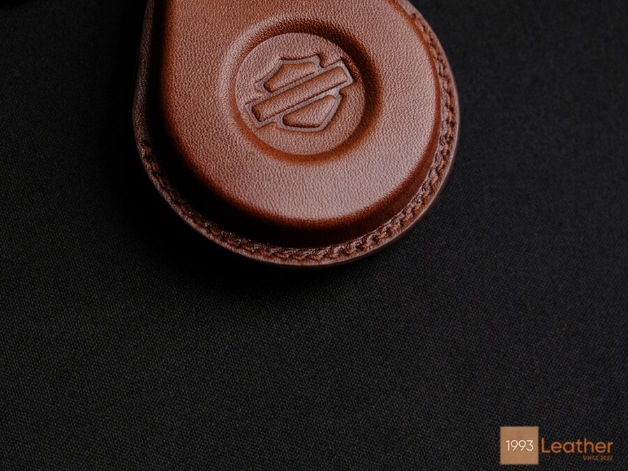 Close-up of Harley Davidson Fat Boy key fob cover representing exquisite and precise stitching on top-class leather.