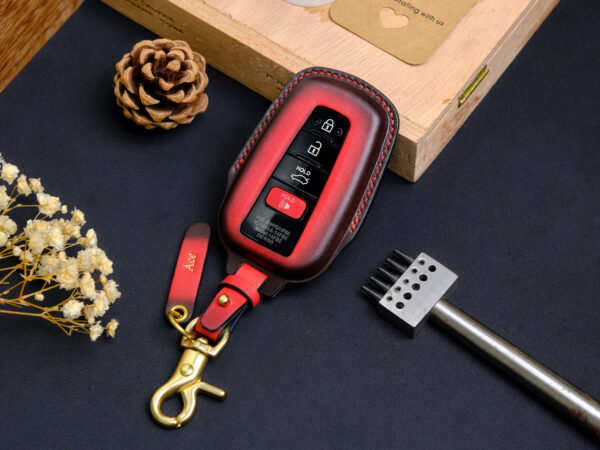 Two Toyota Avalon key fob covers applied keychain and tag engraved