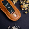 Porsche Macan key fob cover made of high-quality Veg-tanned leather.