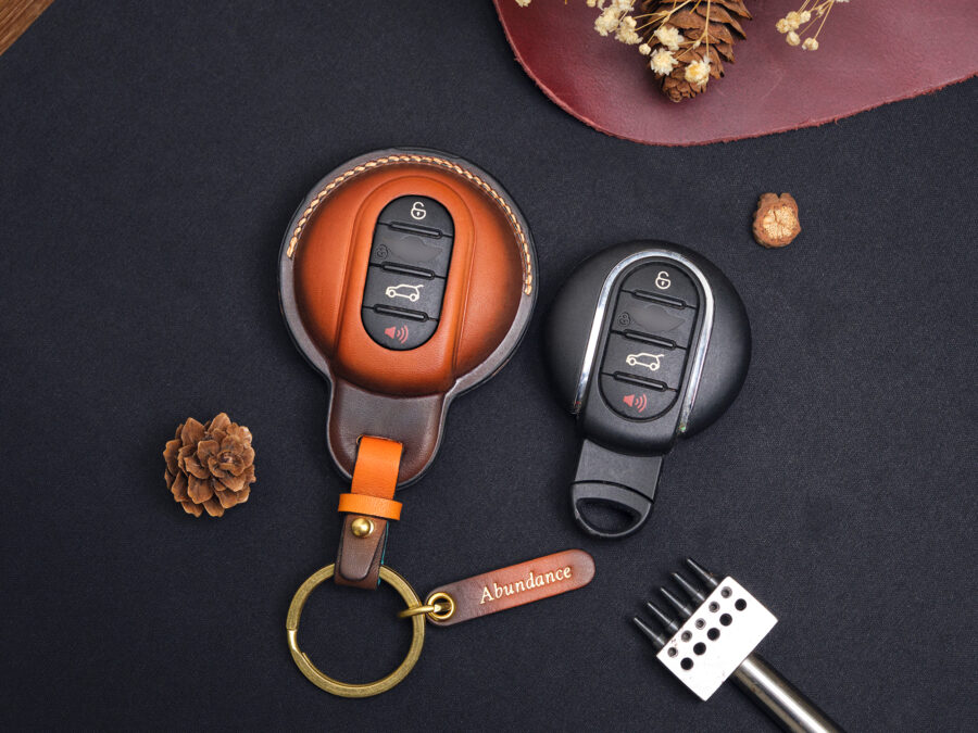 Mini Clubman key fob covers in red, green, and brown with personalized name tags and customizable hardware at Leather1993.