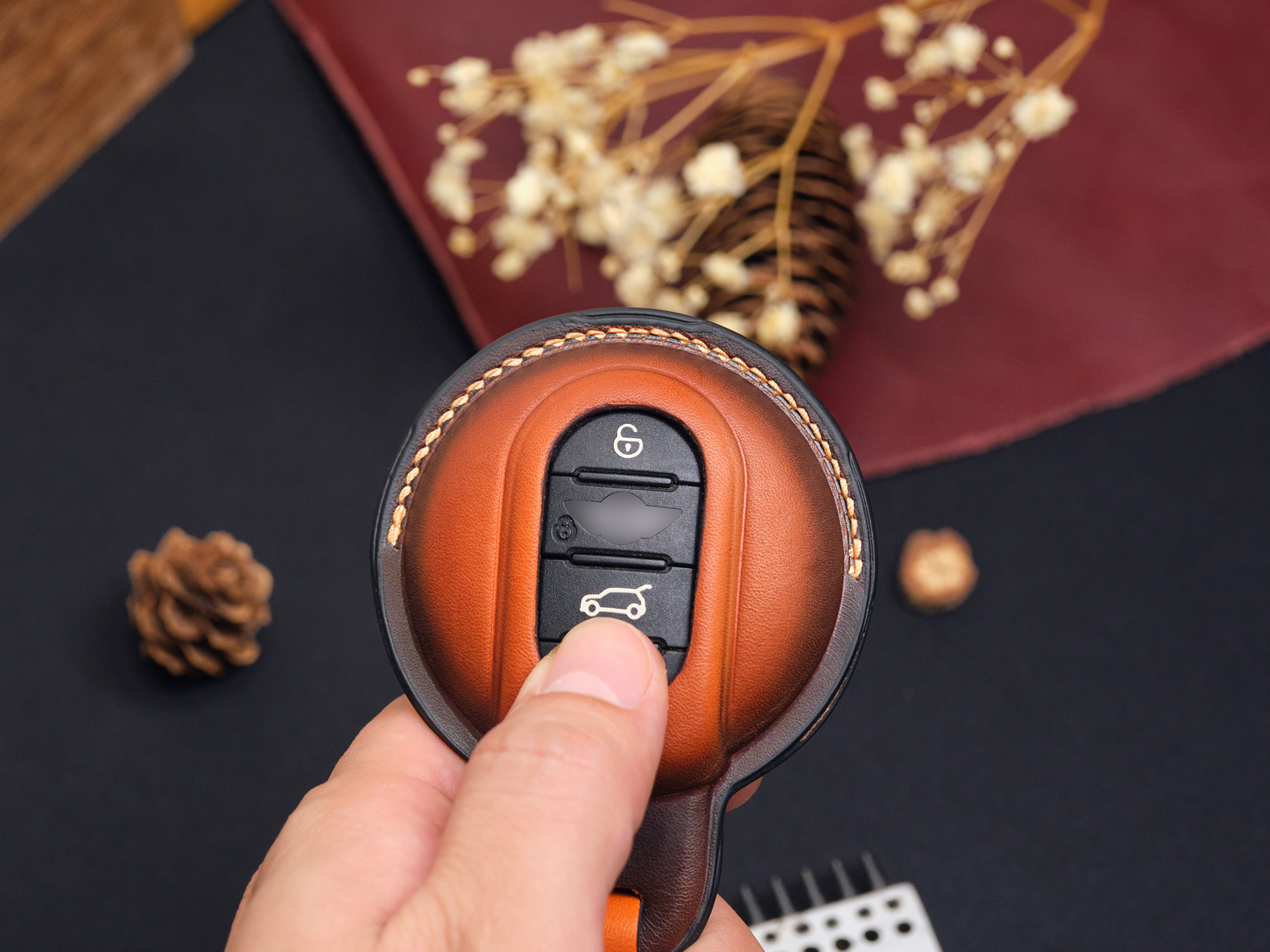 Mini Clubman key fob covers in vibrant green, red, and patina orange showcasing a wide range of color choices.