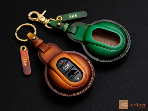 Mini Clubman key fob cover with exposed button design for easy access, featuring customizable name tags and premium leather.