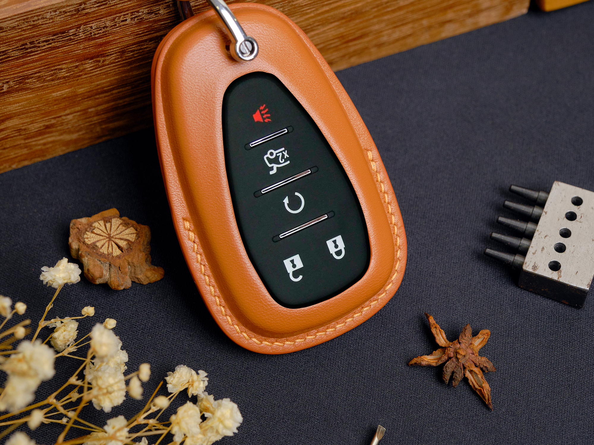 Details of the back of two Chevrolet Camaro key fob cover with meticulous sewing line