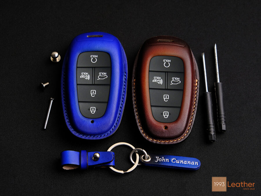 Hyundai Palisade key cover with exposed button design.