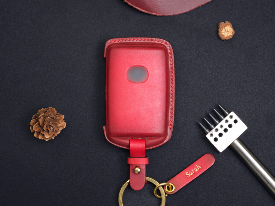 The handcrafted Mazda CX-60 leather key fob case in a brown finish comes with premium tools, personalized leather tags, and brass hardware for added functionality.