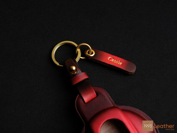 Mini JCW key fob cover featuring a free leather tag engraved with 'Cessie' and gold hardware options.