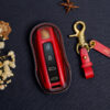Porsche Taycan key fob cover made of high-quality veg-tanned leather, providing a premium and eco-friendly finish.