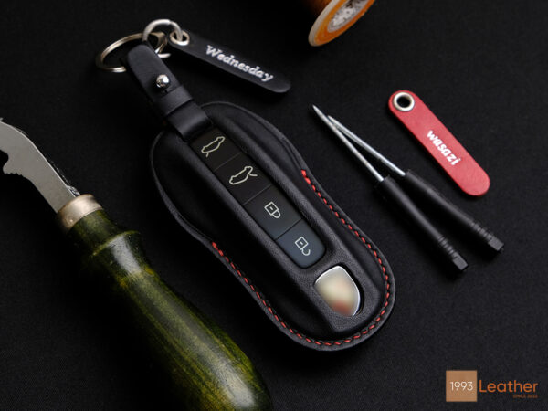 Porsche Taycan key fob cover made of high-quality veg-tanned leather, providing a premium and eco-friendly finish.