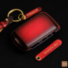 Mazda 2, 3, 6 key fob cover made of premium leather with Patina red finish, personalized name tags, and gold hardware.