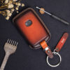 High-quality Veg-Tanned leather Mazda 2, 3, 6 key fob cover in attractive patina red colors with customizable options.