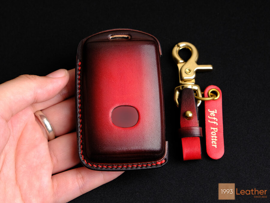 Mazda 2, 3, 6 key fob cover featuring an exposed button design for easy use and personalized with a name tag.