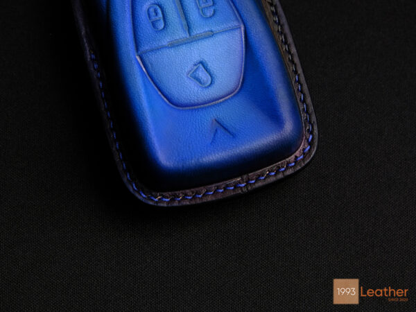 Close-up of the VinFast VF 6 Key Fob Cover featuring exquisite stitching details.