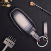 Handmade leather Audi A-series key fob cover in the back side includes customized name tag and keychain