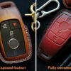 Mercedes E-Class key fob cover shown in two styles: exposed-button design for accessibility and fully-covered design for complete protection.