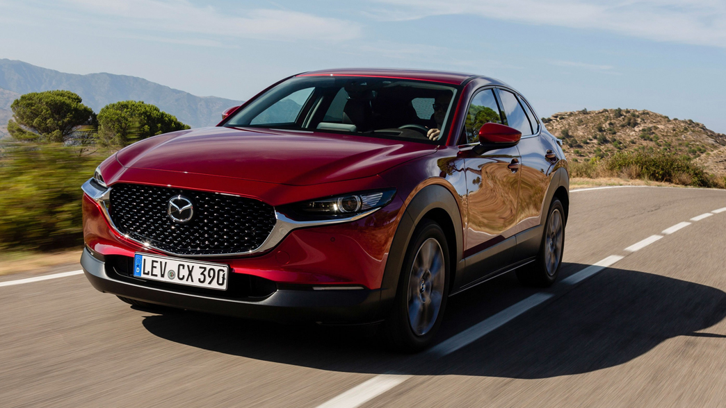 Mazda CX-30 featuring a sleek SUV design with bold lines, a distinctive grille, and modern alloy wheels.