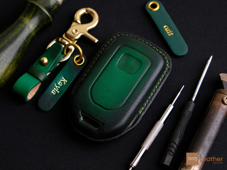 Rear view of the Honda Passport key fob cover in Patina Green, featuring embossed logo details.