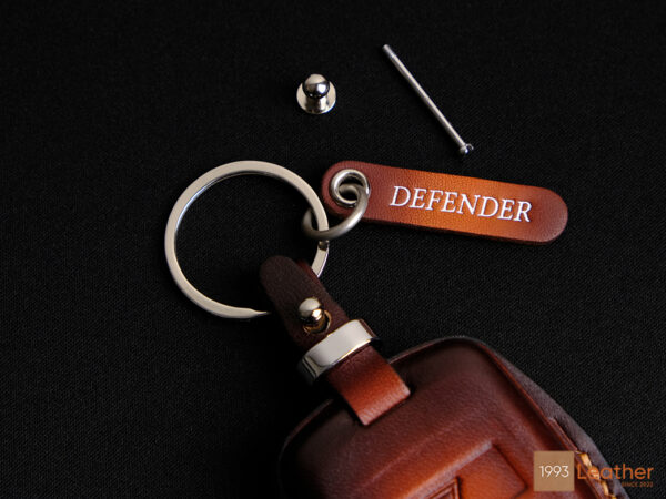 Land Rover Defender key fob cover and name tag keychain with premium leather craftsmanship.