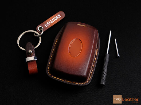 Land Rover Defender leather key case, highlighting exquisite stitching.