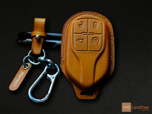 The Maserati Quattroporte leather key case is made of high-quality leather with a beautiful design.