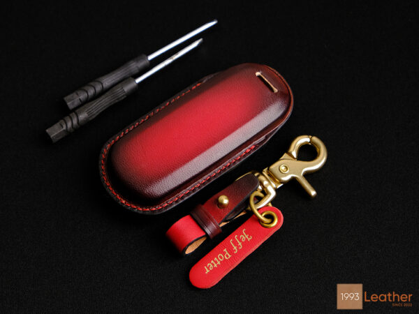 Stylish leather key fob cover with premium finish, featuring smooth texture and perfect fit.