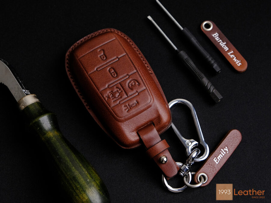 Premium RAM 1500 key fob cover crafted from high-quality leather, featuring elegant hardware and personalized engraving.