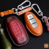 Nissan Frontier key fob cover crafted from high-end Veg-tanned leather for enduring condition.