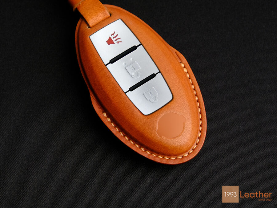 Nissan Frontier key fob cover featuring exquisite stitching for refined craftsmanship.