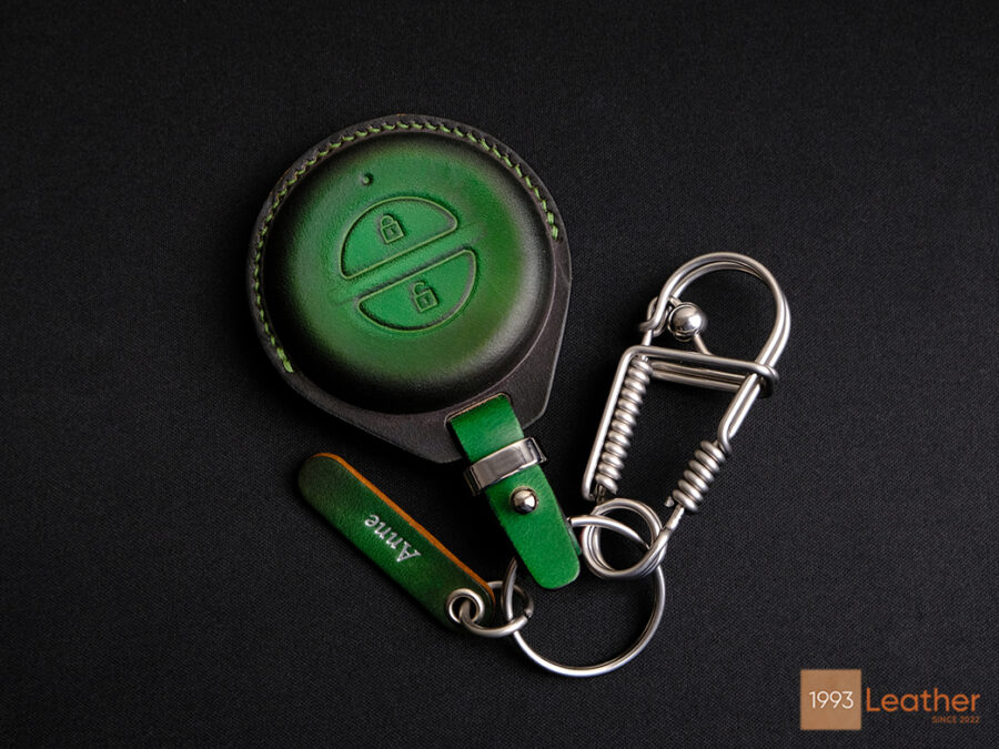 High-end leather key fob cover with a superb stainless steel keychain, featuring a free engraved tag.