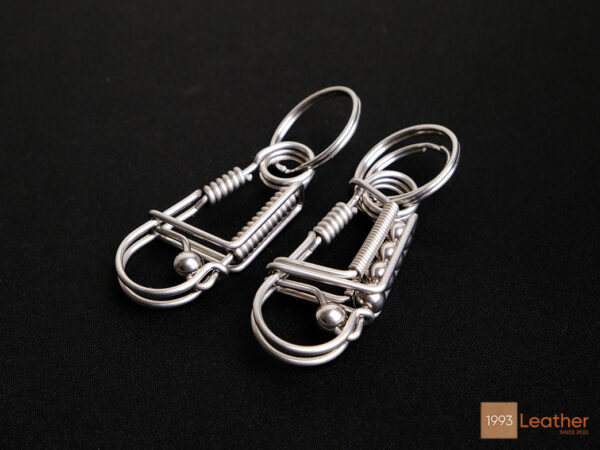 One-of-a-kind handcrafted stainless steel keychains with a durable and artistic design.