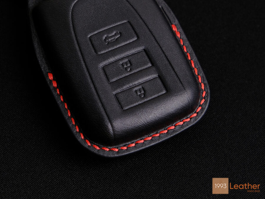 Elevate your key fob with the Toyota Vios Key Fob Cover, featuring exquisite precision stitching for a refined look and durability.