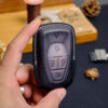 Vinfast VF 9 key fob cover showcasing intricately crafted stitching for a premium finish.