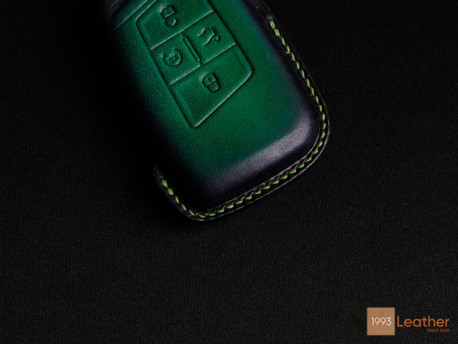 Close-up of Volkswagen Passat key fob cover showcasing exquisite stitching detail.