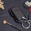 Close-up of Volkswagen Virtus key fob cover highlighting exquisite stitching details.