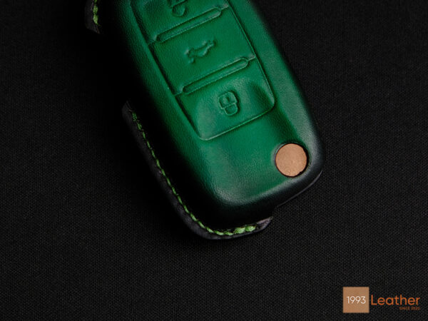 Close-up of Volkswagen Virtus key fob cover highlighting exquisite stitching details.