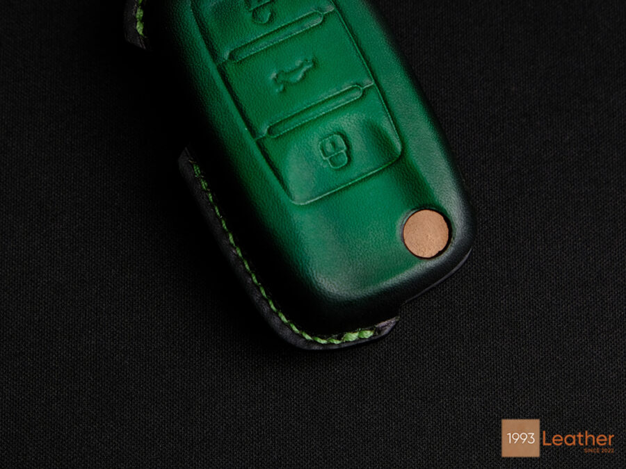 Close-up of Volkswagen Virtus key fob cover highlighting exquisite stitching details.