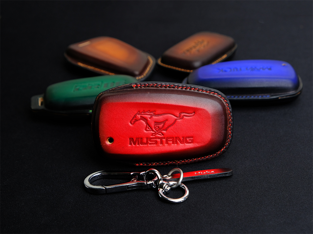 Key fob covers at Leather1993 made of Vegtan leather can be customized for logo in the backside or tag of all car brands