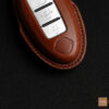Nissan Leaf key cover with delicate stitching for a sophisticated look.