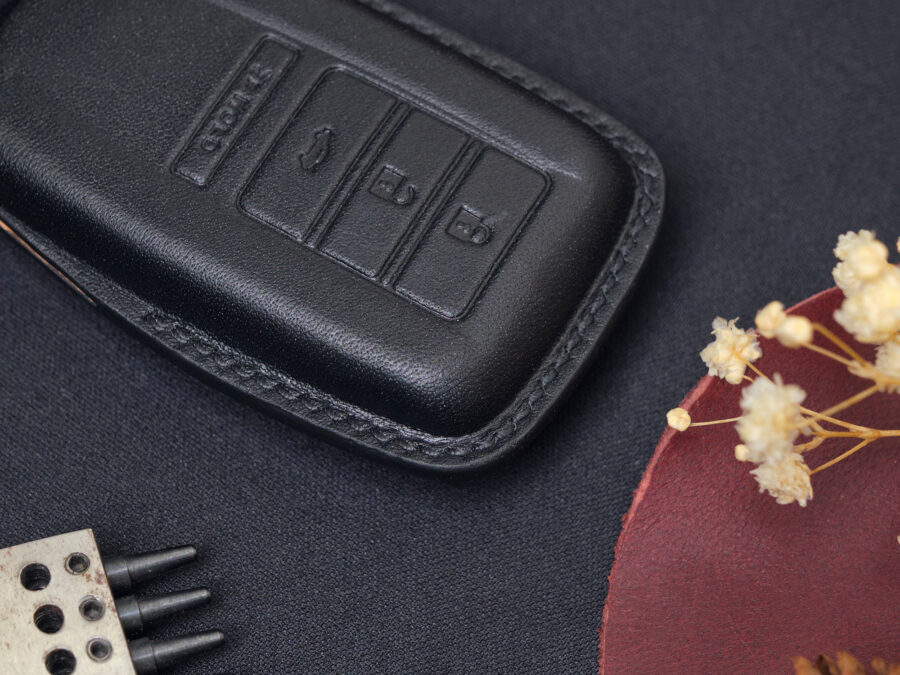 Zoom in Acura TLX leather key fob cover in version fully cover highlighting exquisite hand stitching and protect key well