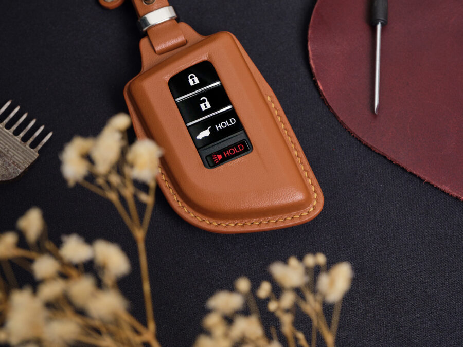 Leather Acura ZDX key fob cover front view showing button layout and stitched edges