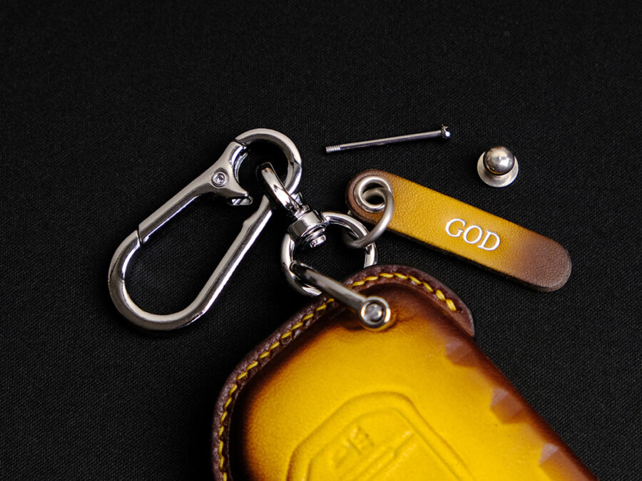Jeep Grand Cherokee key fob cover made of premium leather, featuring a free engraved tag and four hardware options for added personalization