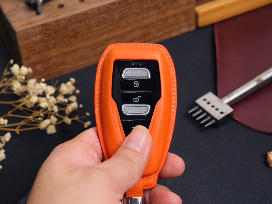 High-quality leather key fob cover for Aston Martin DBX designed to deliver a smooth, ergonomic grip with a luxurious feel in hand.